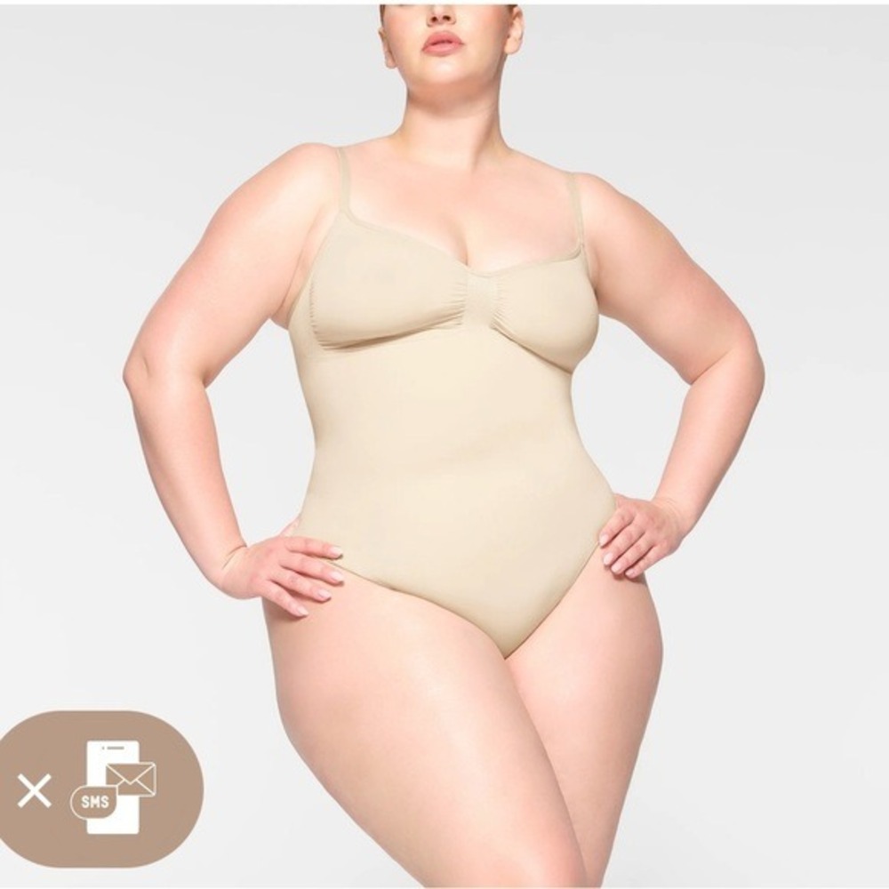 SKIMS Seamless Thong‎ Sculpt Bodysuit SHAPEWEAR in a light nude color
